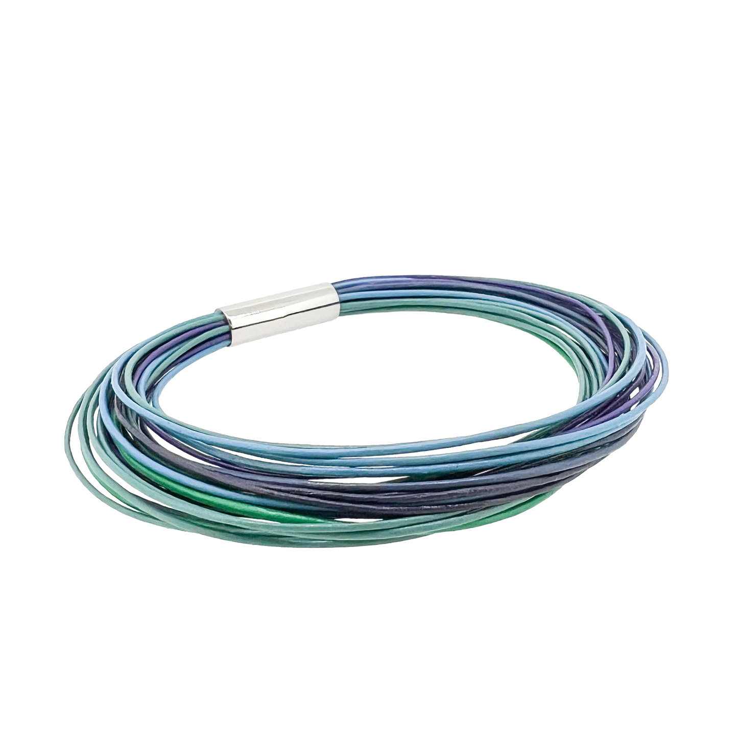 Indulge in the Northern Lights Bracelet featuring 40 strands of 0.5mm leather and a sleek 8mm titanium magnetic lock. Captivated by the beauty of Iceland's aurora borealis, this piece is skillfully crafted by Zeezen.